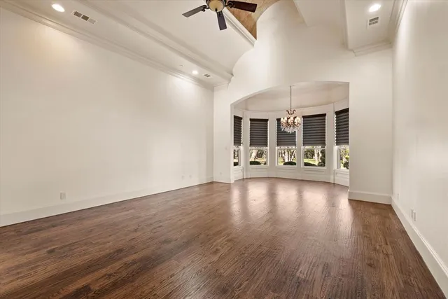 a view of a room with wooden floor