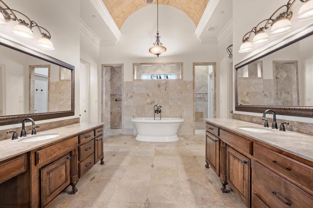 1600 Enclave Court Southlake, TX 76092 - Photo 10 of 40 a spacious bathroom with a double vanity sink a mirror and a bathtub