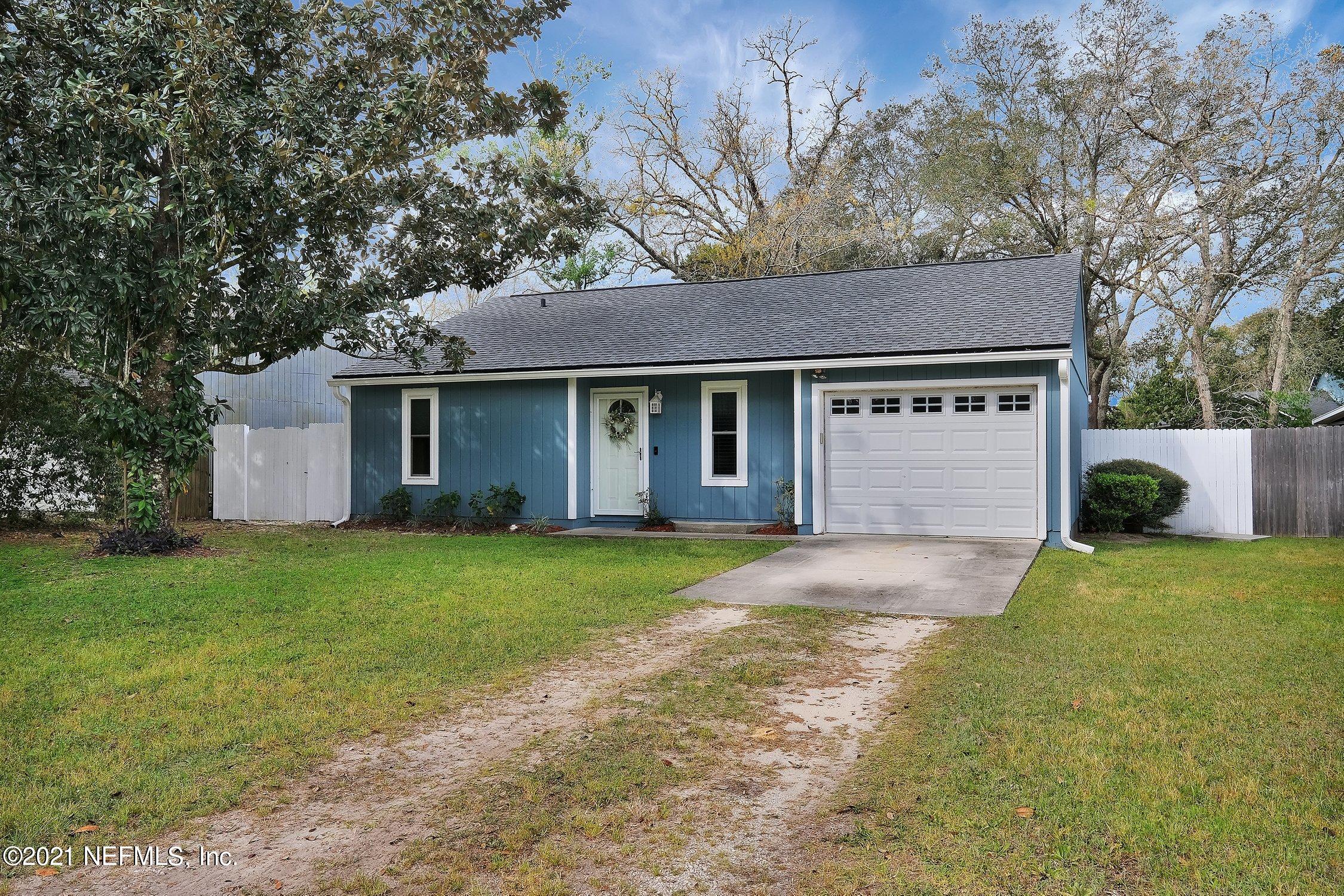 12840 Beaubien Road Jacksonville, FL 32258 - Photo 2 of 25 a front view of a house with a yard and garage