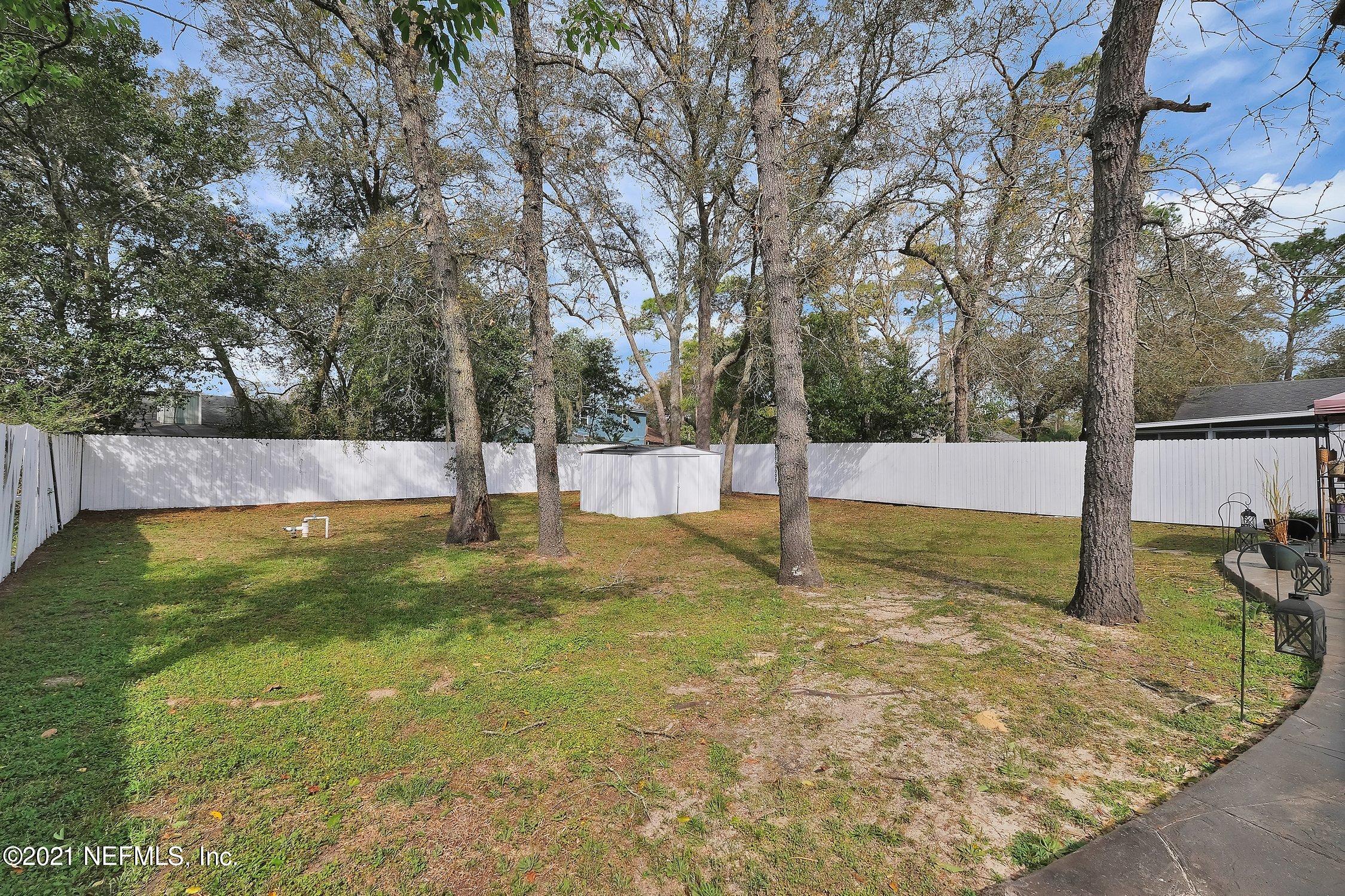 12840 Beaubien Road Jacksonville, FL 32258 - Photo 24 of 25 a view of a backyard with trees