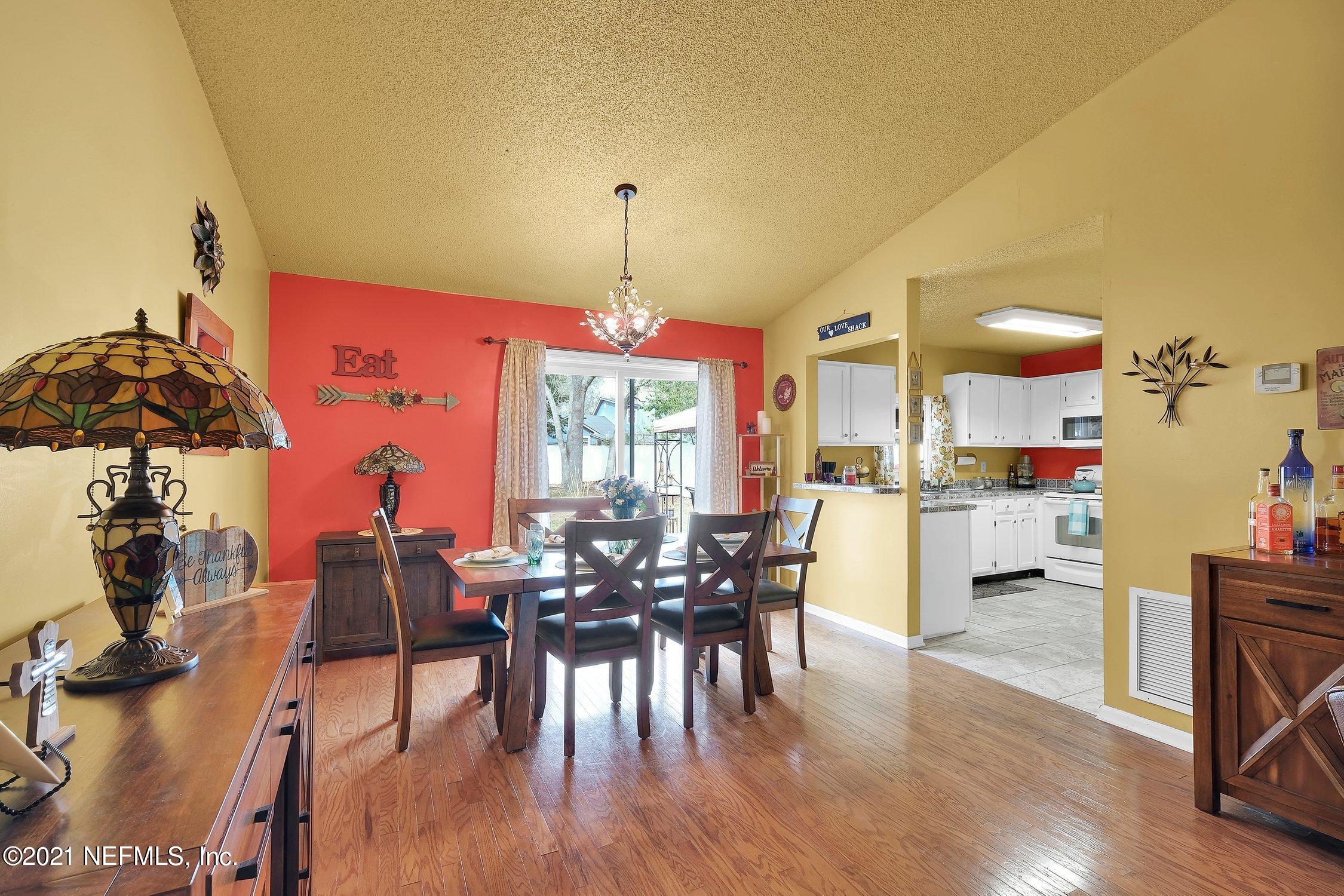 12840 Beaubien Road Jacksonville, FL 32258 - Photo 8 of 25 a view of a dining room with furniture and wooden floor