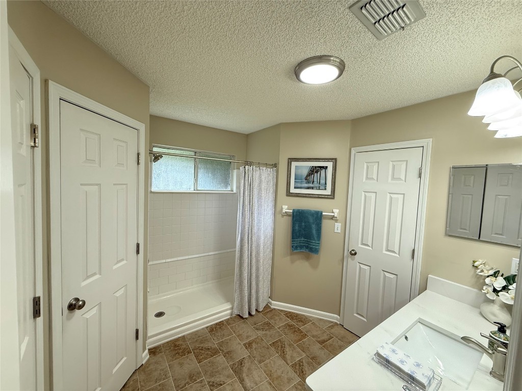 96118 Green Pine Road Yulee, FL 32097 - Photo 12 of 20 a bathroom with a sink and shower