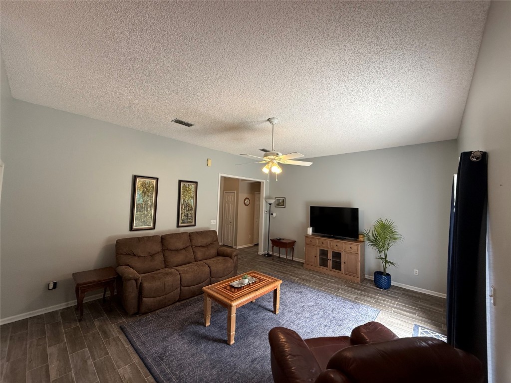 96118 Green Pine Road Yulee, FL 32097 - Photo 6 of 20 a living room with furniture and a flat screen tv