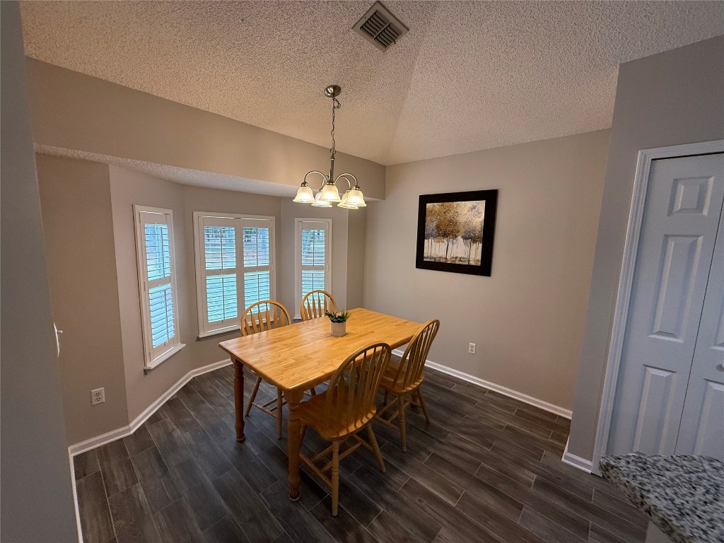 96118 Green Pine Road Yulee, FL 32097 - Photo 9 of 20 a view of a dining room with furniture window and wooden floor