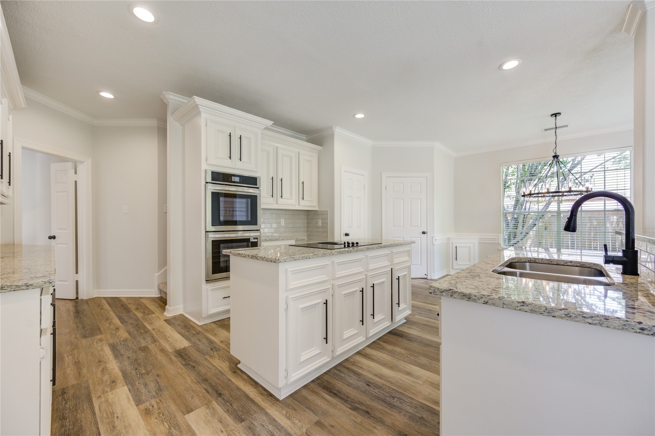 17318 Bonnard Circle Spring, TX 77379 - Photo 1 of 45 Behind the new double oven, there is a secondary staircase leading up to the enormous gameroom!