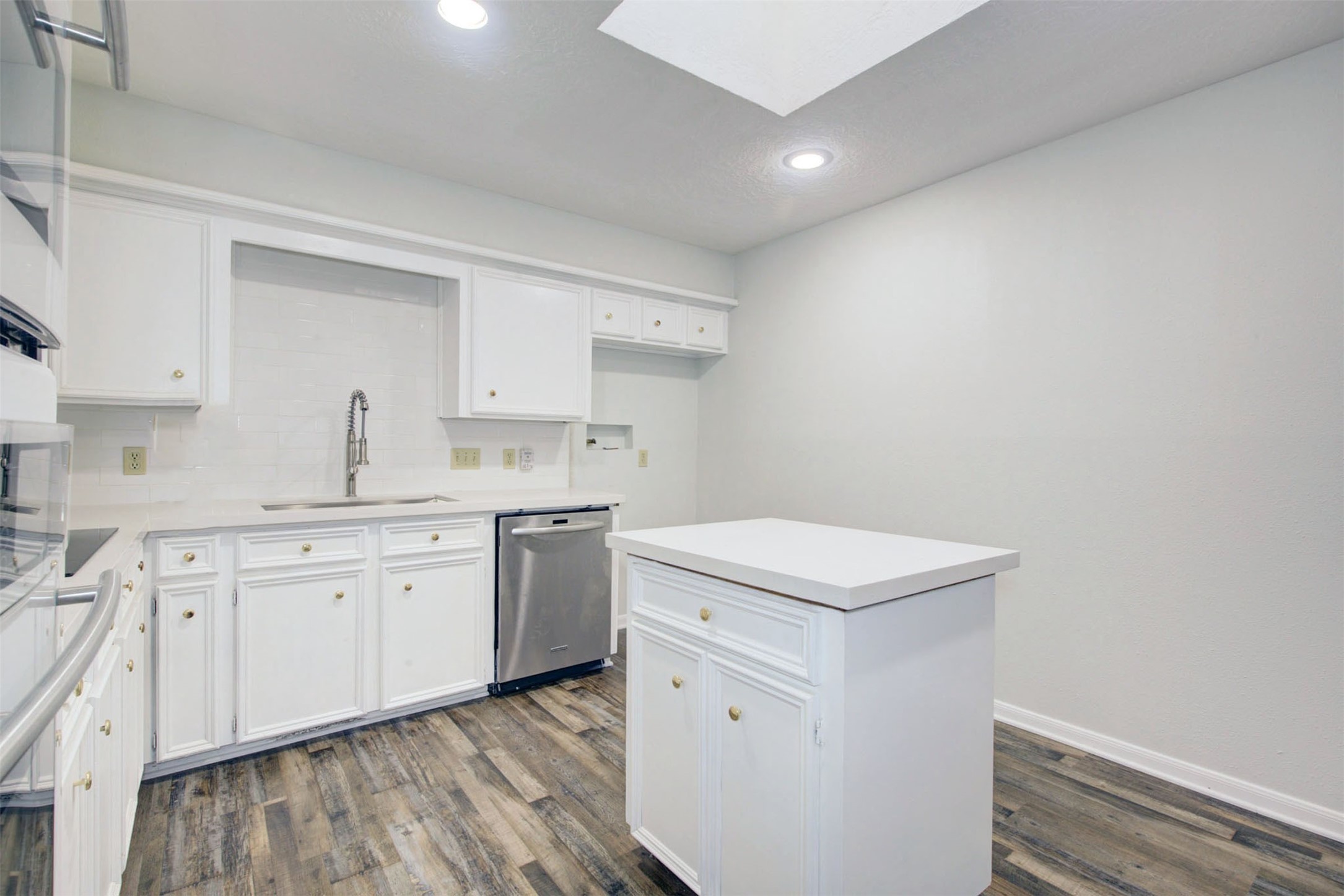 1402 Forest Home Drive Houston, TX 77077 - Photo 11 of 35 a kitchen with a sink cabinets and wooden floor