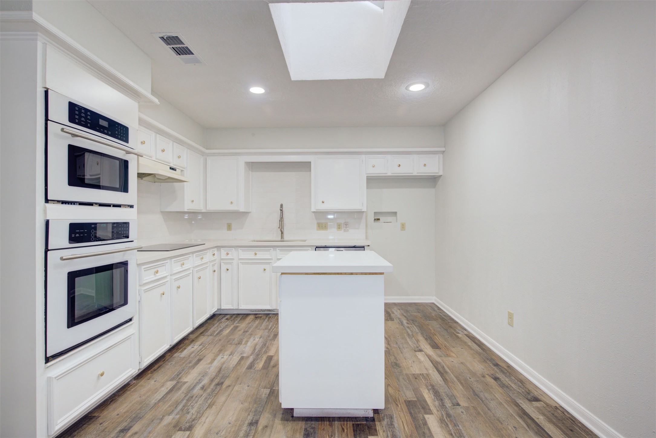 1402 Forest Home Drive Houston, TX 77077 - Photo 12 of 35 a kitchen with a sink cabinets and stainless steel appliances