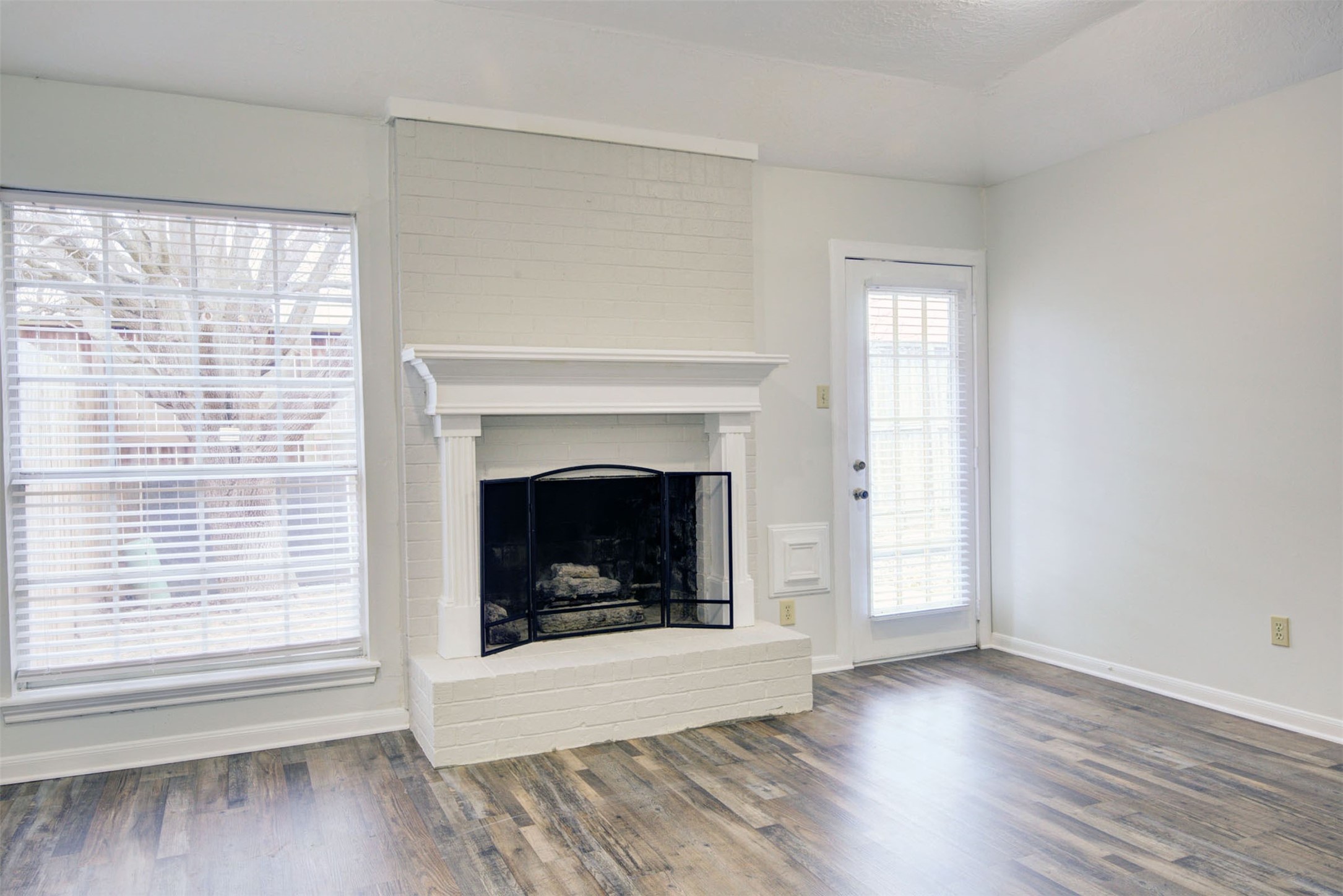 1402 Forest Home Drive Houston, TX 77077 - Photo 13 of 35 a view of a livingroom with a fireplace and window