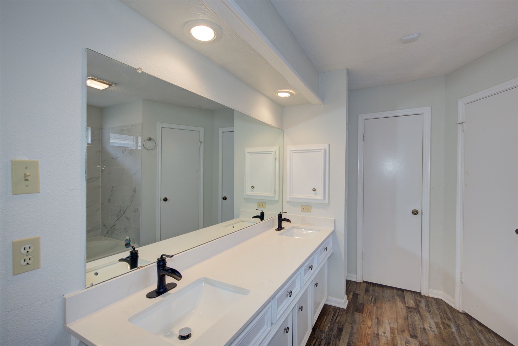 1402 Forest Home Drive Houston, TX 77077 - Photo 18 of 35 a spacious bathroom with a sink and a mirror