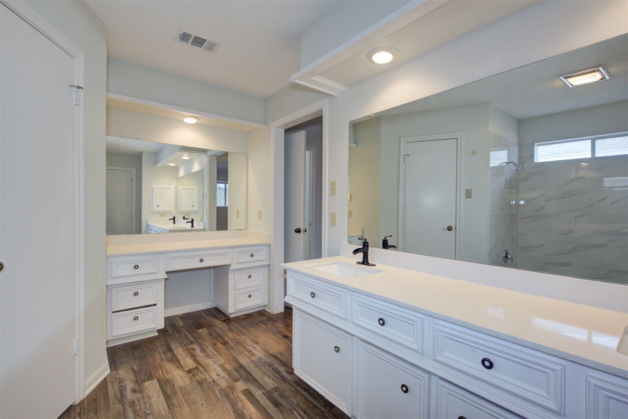 1402 Forest Home Drive Houston, TX 77077 - Photo 19 of 35 a spacious bathroom with a granite countertop sink mirror and bathtub