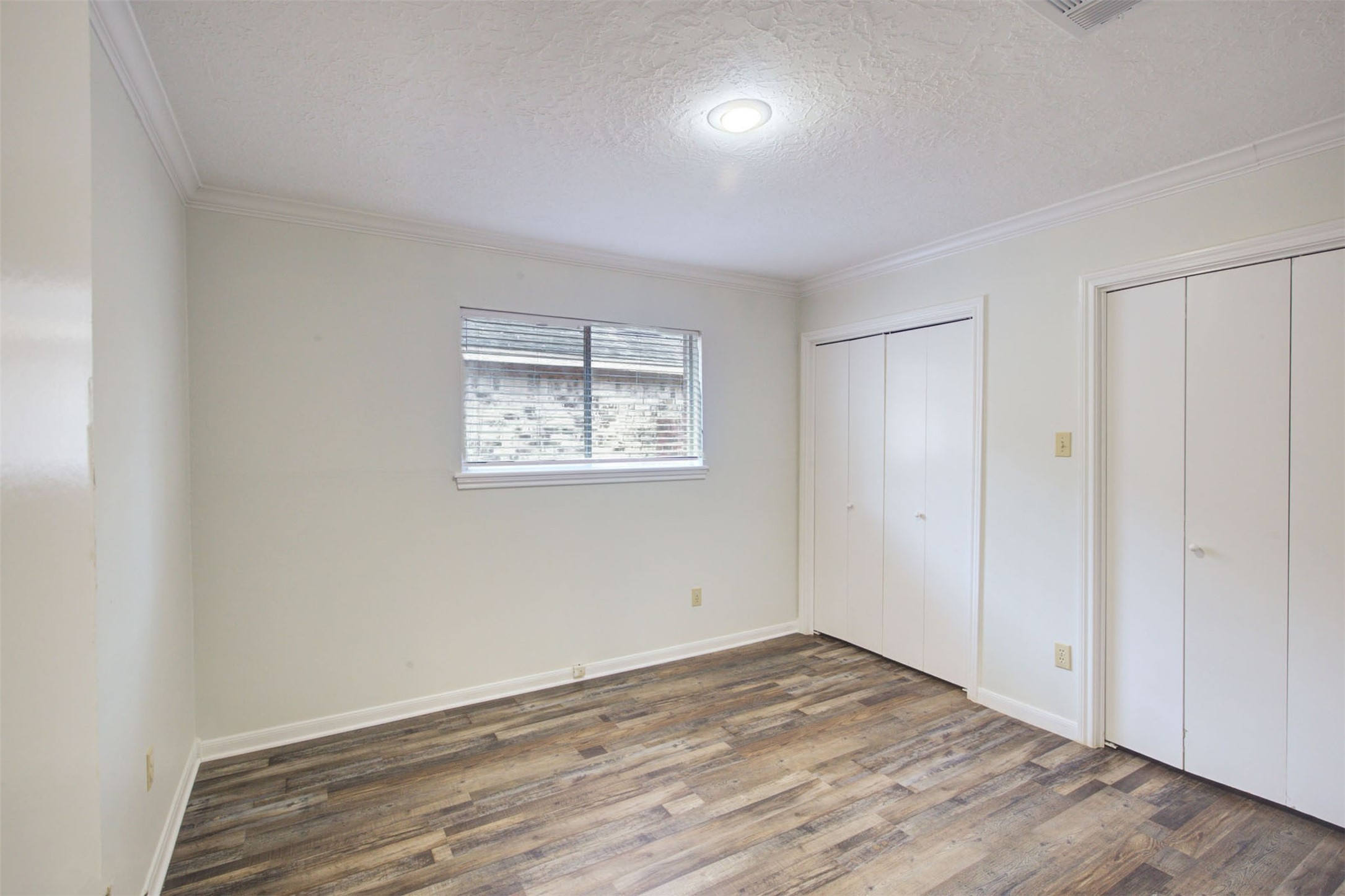 1402 Forest Home Drive Houston, TX 77077 - Photo 20 of 35 a view of empty room with wooden floor