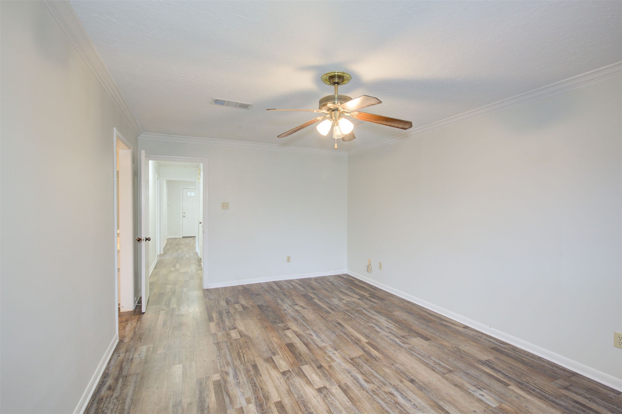 1402 Forest Home Drive Houston, TX 77077 - Photo 31 of 35 wooden floor in an empty room with a window
