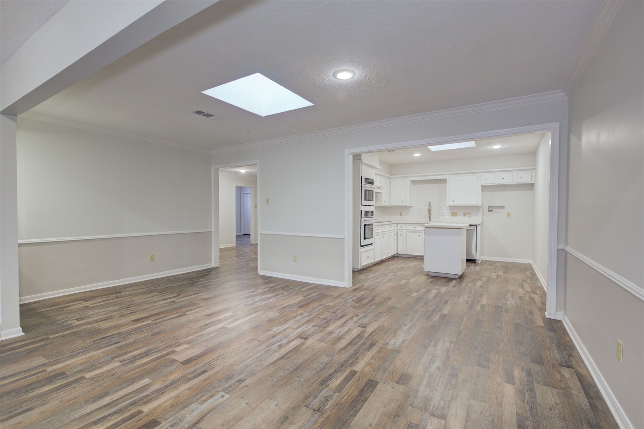 1402 Forest Home Drive Houston, TX 77077 - Photo 10 of 35 a view of empty room with wooden floor