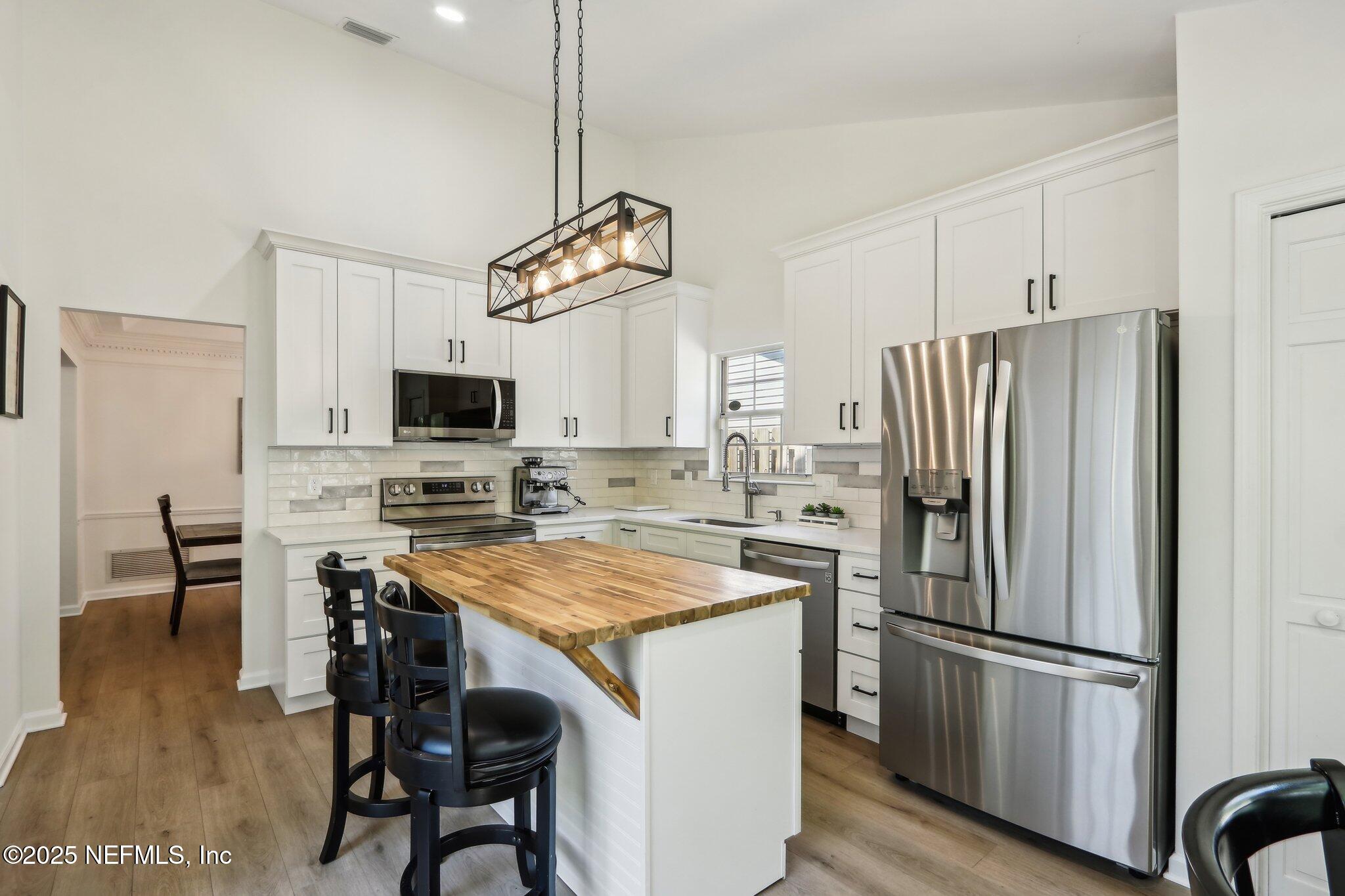 8727 Goodbys Trace Drive Jacksonville, FL 32217 - Photo 12 of 32 a kitchen with appliances cabinets and furniture
