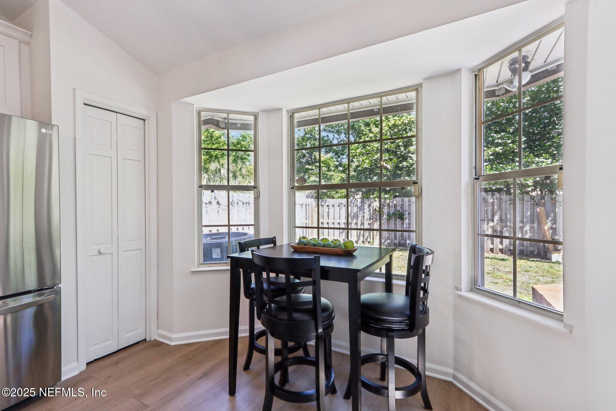 8727 Goodbys Trace Drive Jacksonville, FL 32217 - Photo 14 of 32 a view of a dining room with furniture and a window