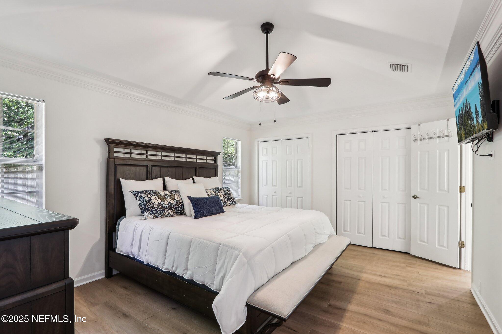 8727 Goodbys Trace Drive Jacksonville, FL 32217 - Photo 16 of 32 a bedroom with a bed and a flat screen tv