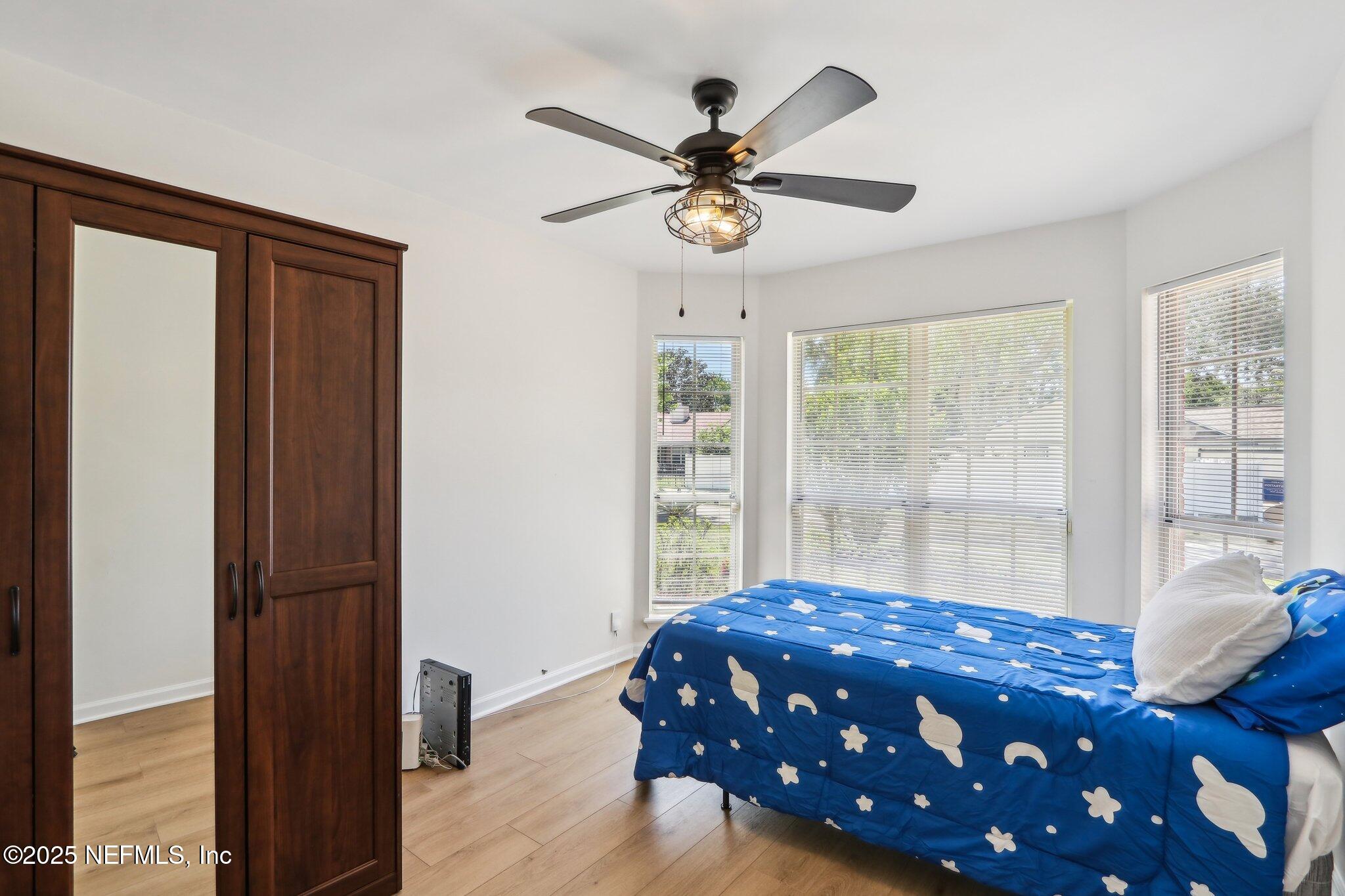 8727 Goodbys Trace Drive Jacksonville, FL 32217 - Photo 22 of 32 a bedroom with a bed and a window