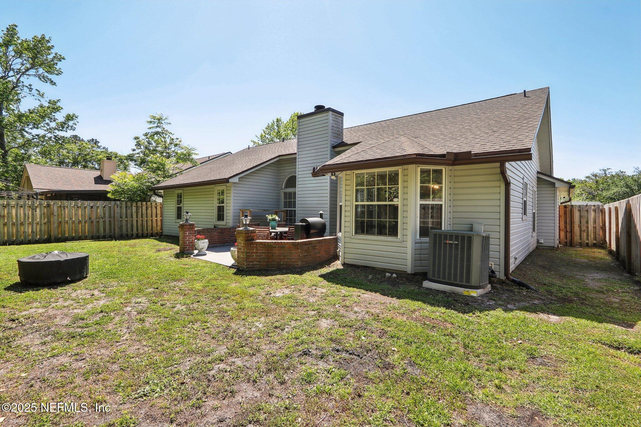 8727 Goodbys Trace Drive Jacksonville, FL 32217 - Photo 31 of 32 a view of a house with backyard and sitting area