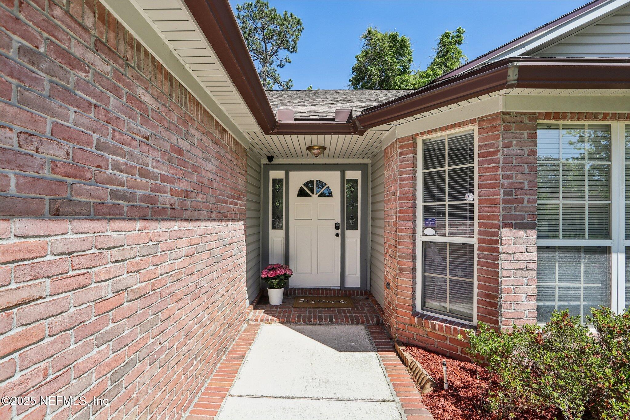 8727 Goodbys Trace Drive Jacksonville, FL 32217 - Photo 4 of 32 a front view of a house with a rug