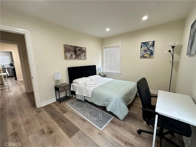 a bedroom with a bed and a table