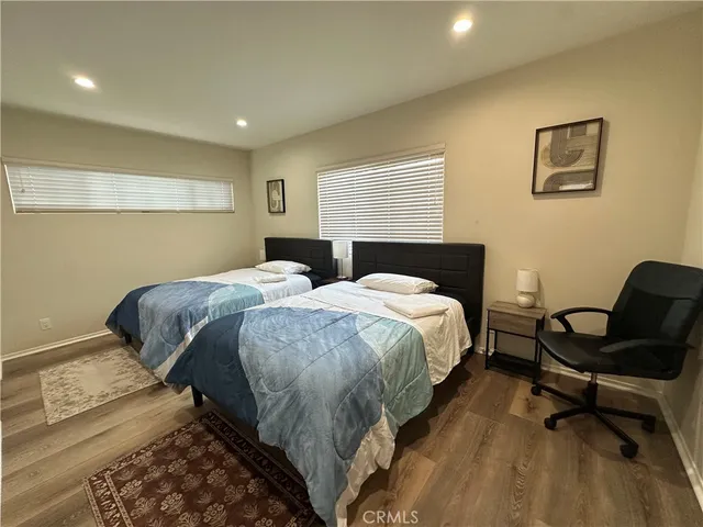 a bedroom with bed and a window