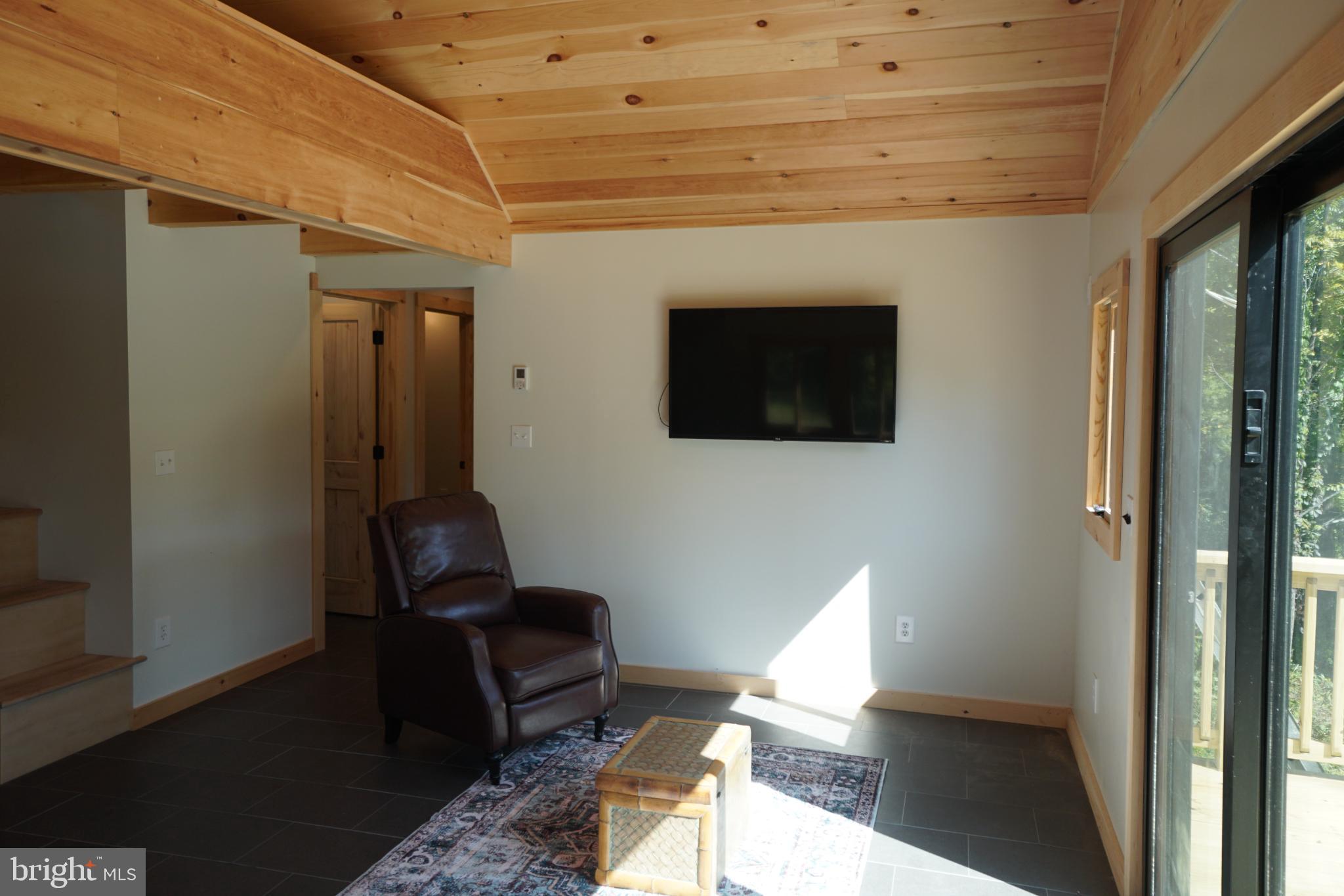 789 Upper South Branch Road Franklin, WV 26807 - Photo 13 of 50 a living room with furniture and a flat screen tv