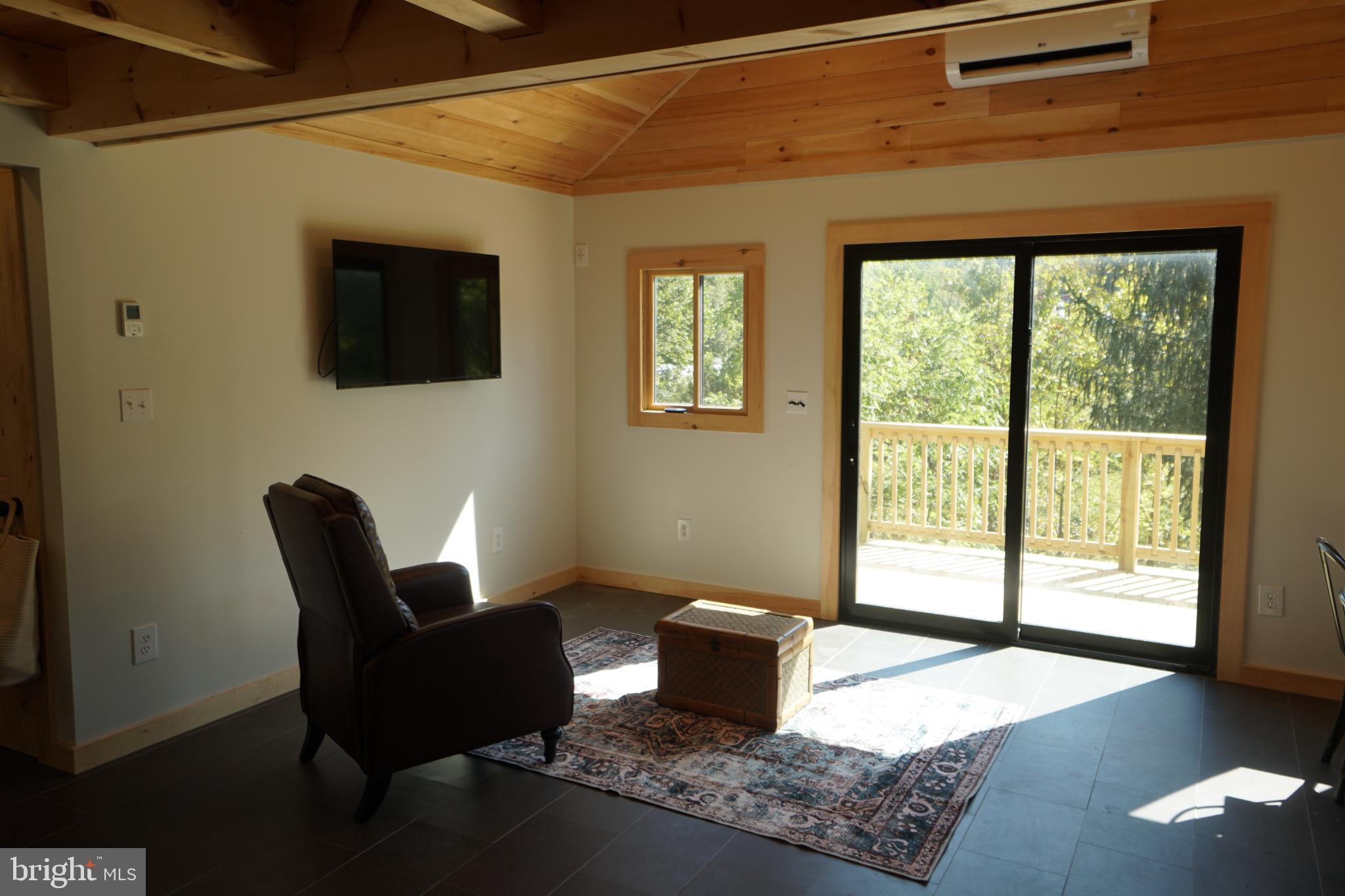 789 Upper South Branch Road Franklin, WV 26807 - Photo 14 of 50 a living room with furniture and a window
