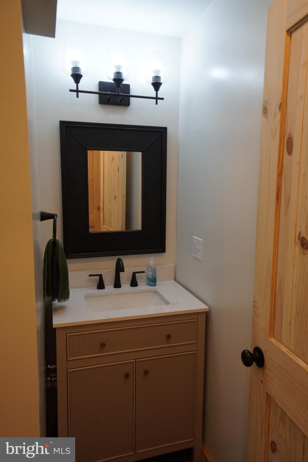 789 Upper South Branch Road Franklin, WV 26807 - Photo 24 of 50 a bathroom with a sink and a mirror