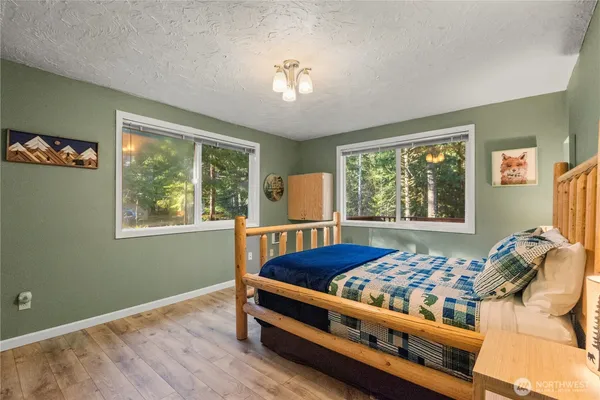 a bedroom with furniture and a window
