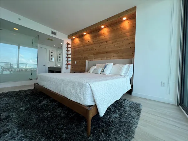 a bathroom with a double vanity sink and mirror