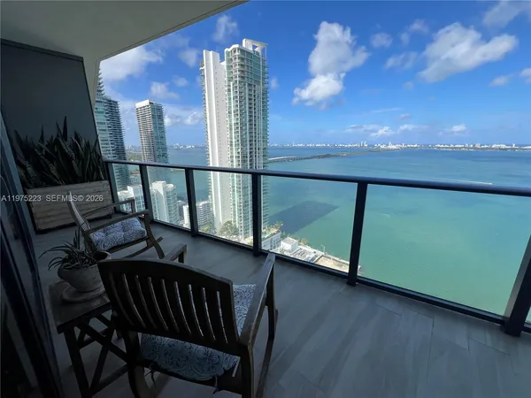 a view of a balcony with furniture