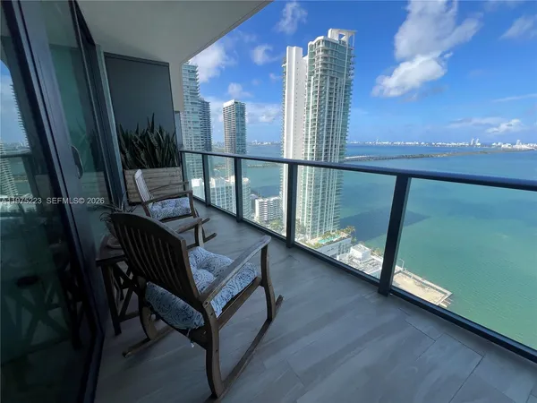 a view of balcony with furniture