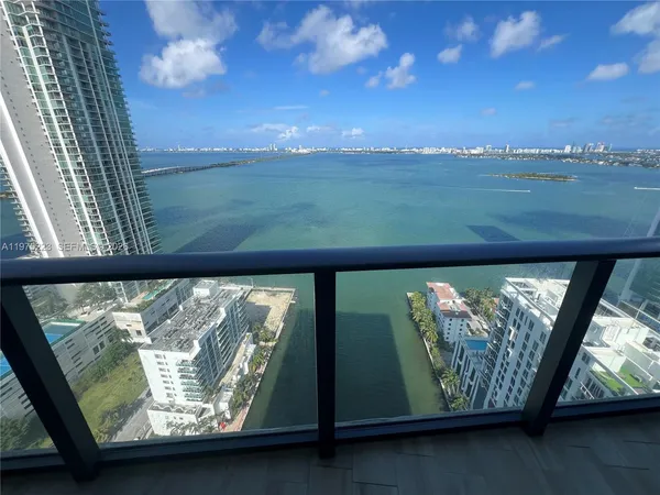 a kitchen with a table chairs stove and cabinets