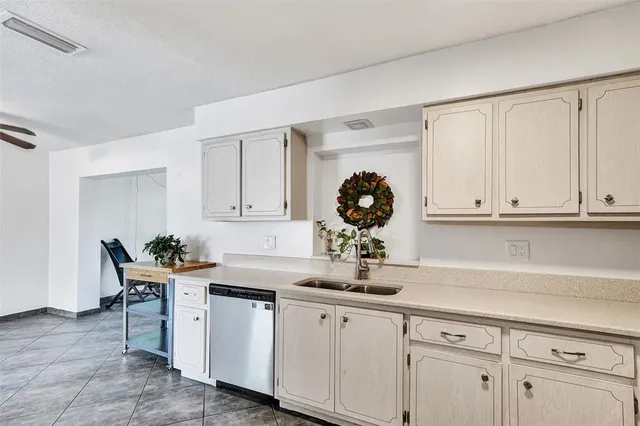 a kitchen with a sink and cabinets