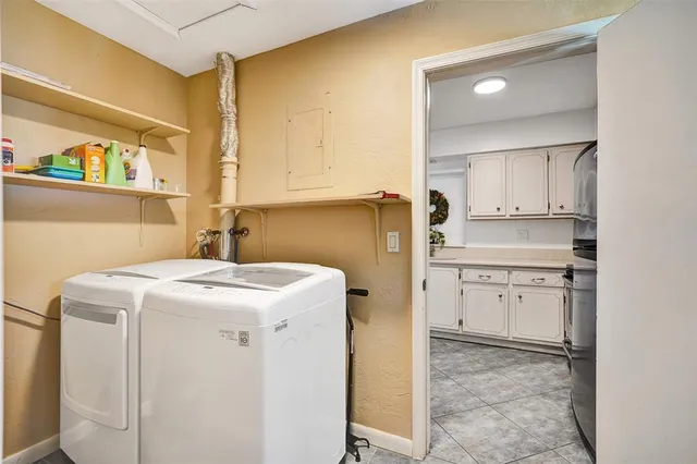 a utility room with sink washer and dryer