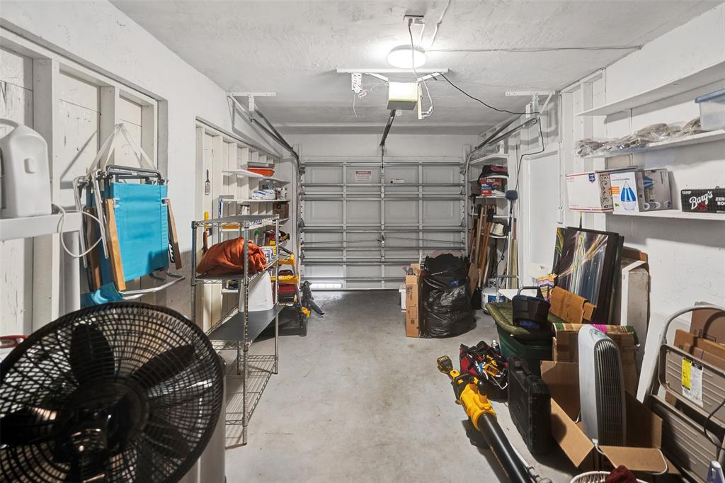 7003 Northwest 95th Terrace Tamarac, FL 33321 - Photo 18 of 44 a view of a room with gym equipment