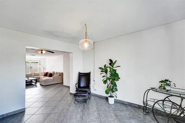 a living room with furniture and flowers