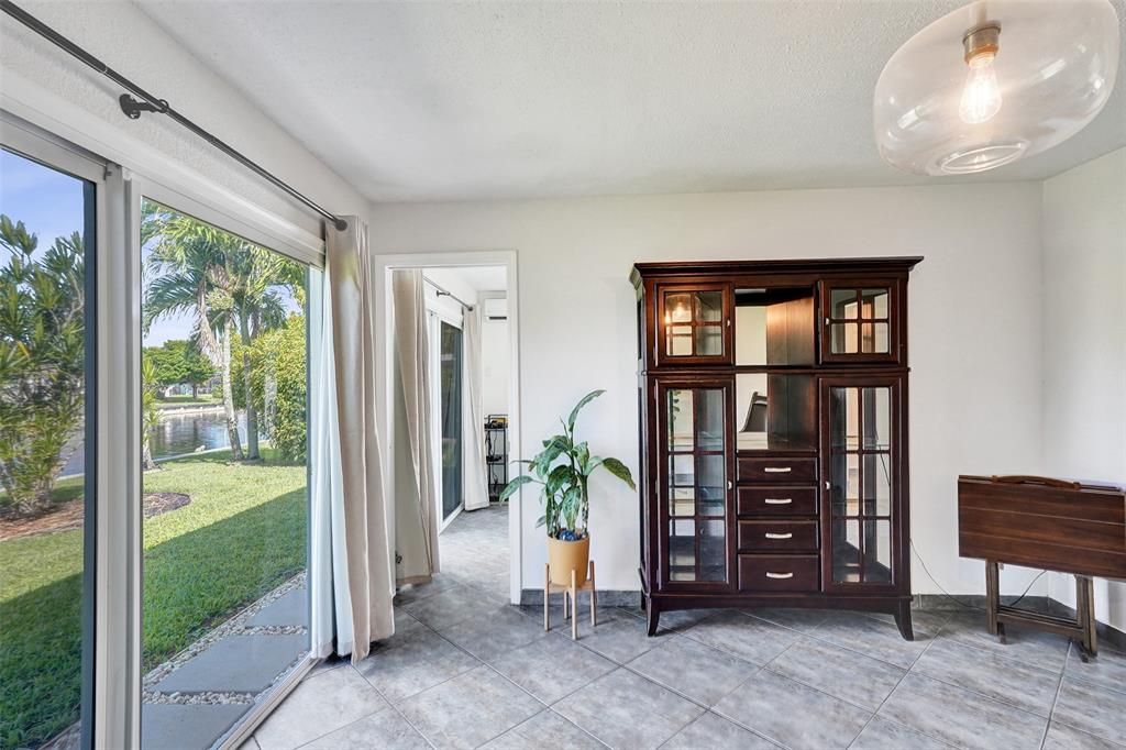 7003 Northwest 95th Terrace Tamarac, FL 33321 - Photo 21 of 44 a view of livingroom with furniture and closet area
