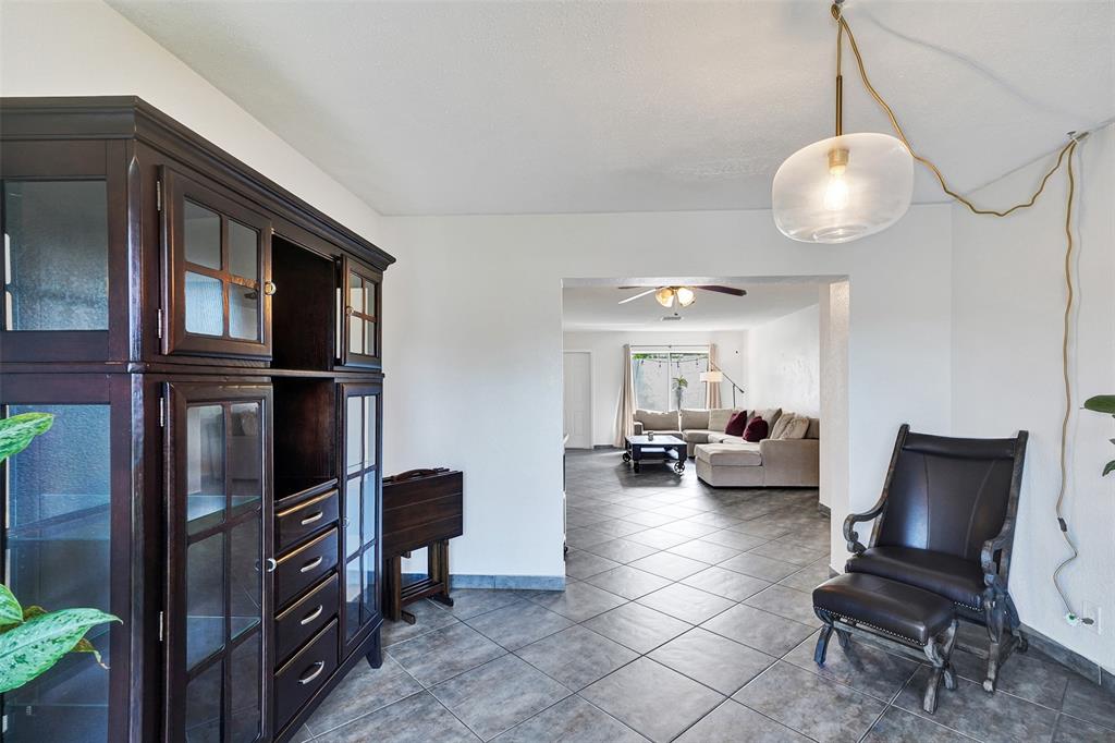 7003 Northwest 95th Terrace Tamarac, FL 33321 - Photo 25 of 44 a view of a livingroom with furniture and a window