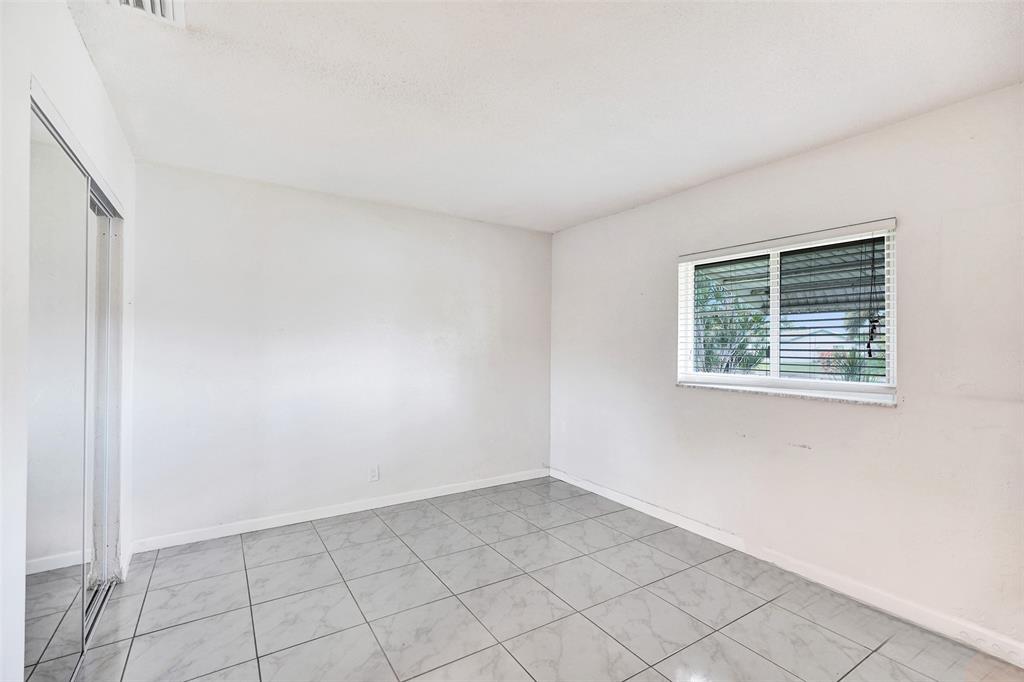 7003 Northwest 95th Terrace Tamarac, FL 33321 - Photo 30 of 44 an empty room with windows
