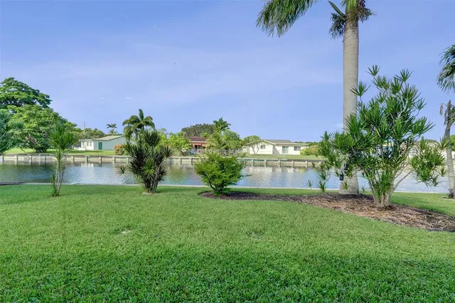 a view of a garden with a building in the background
