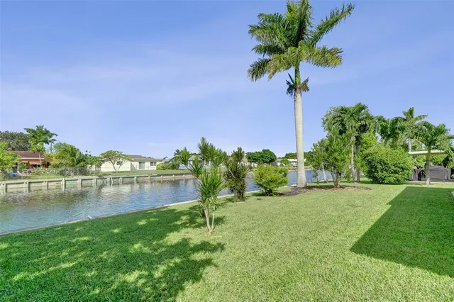 a view of lake with houses in the background