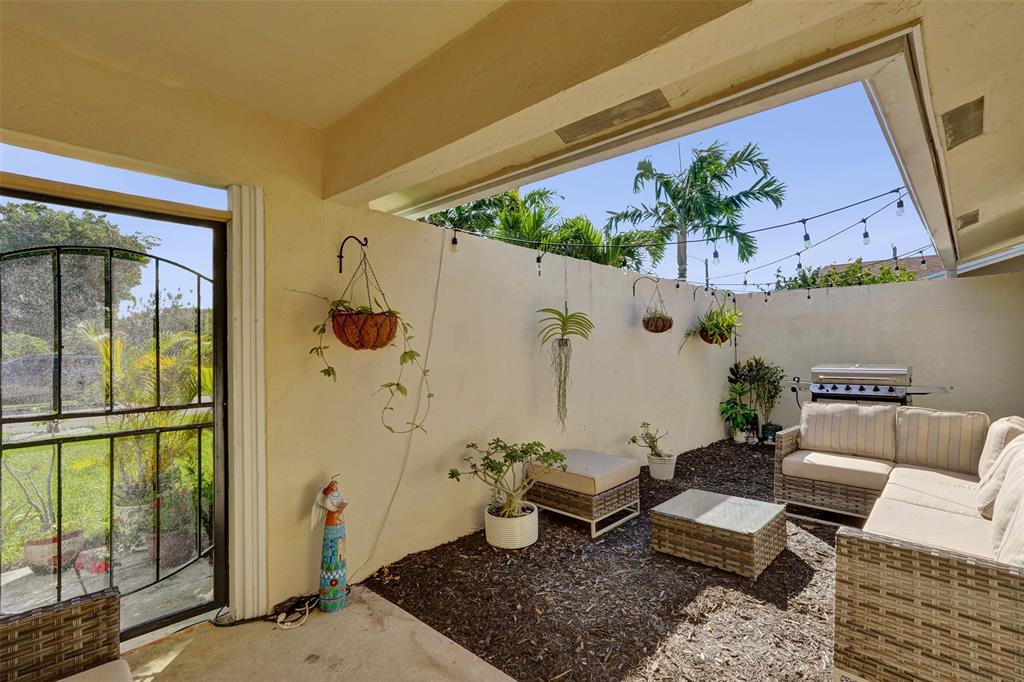 7003 Northwest 95th Terrace Tamarac, FL 33321 - Photo 7 of 44 a living room with furniture and wooden floor