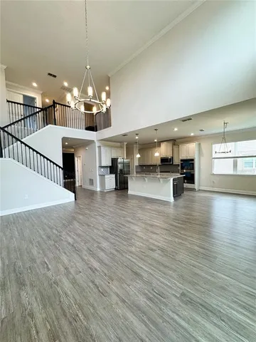 a view of a room with lots of wooden furniture