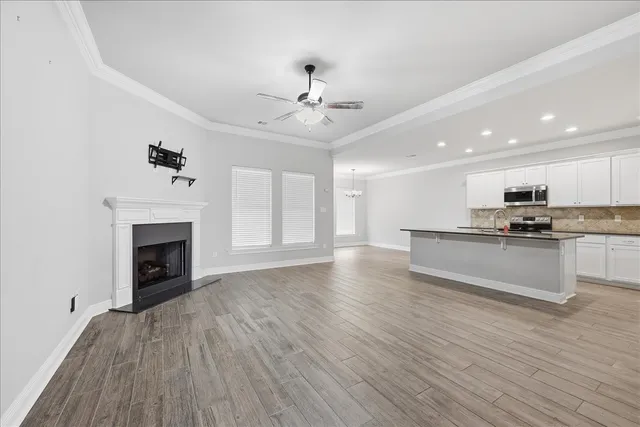 a view of kitchen with granite countertop cabinets and wooden floor