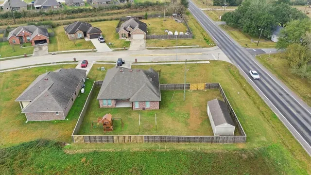 a view of swimming pool with a garden and plants
