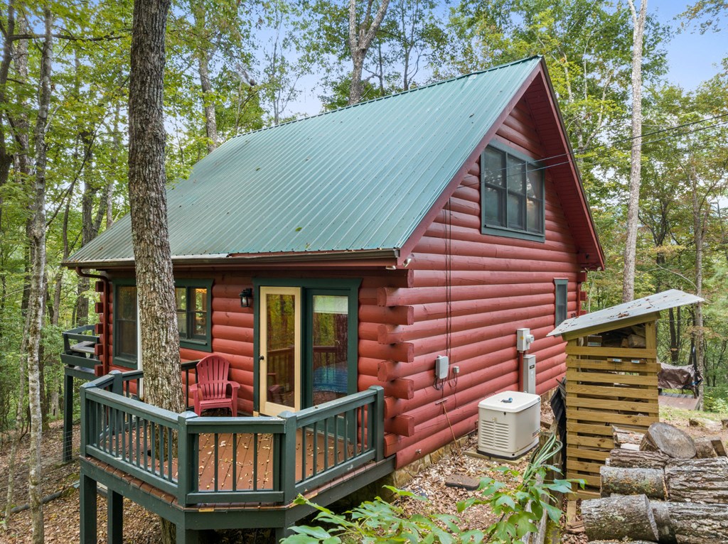 390 Butler Creek Road Cherry Log, GA 30522 - Photo 19 of 20 a front view of a house with balcony