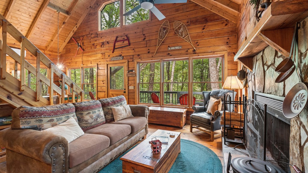 390 Butler Creek Road Cherry Log, GA 30522 - Photo 5 of 20 a living room with furniture a rug and a floor to ceiling window