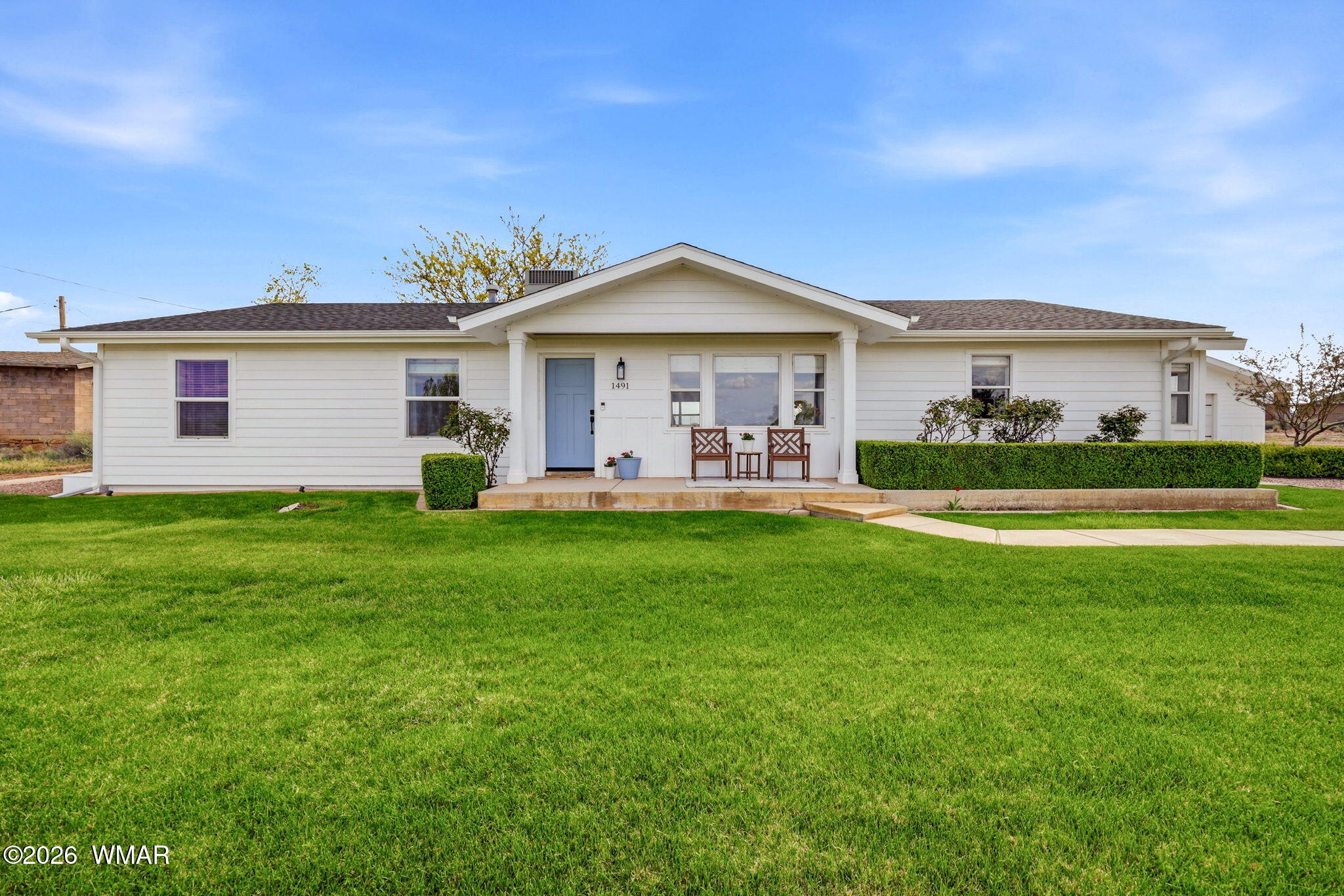 1491 Hunsaker Road Holbrook, AZ 86025 - Photo 1 of 40 a front view of house with yard and green space