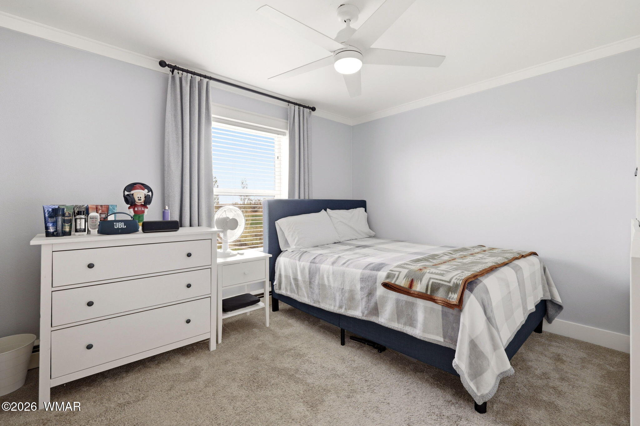 1491 Hunsaker Road Holbrook, AZ 86025 - Photo 20 of 40 a bedroom with a bed and a dresser